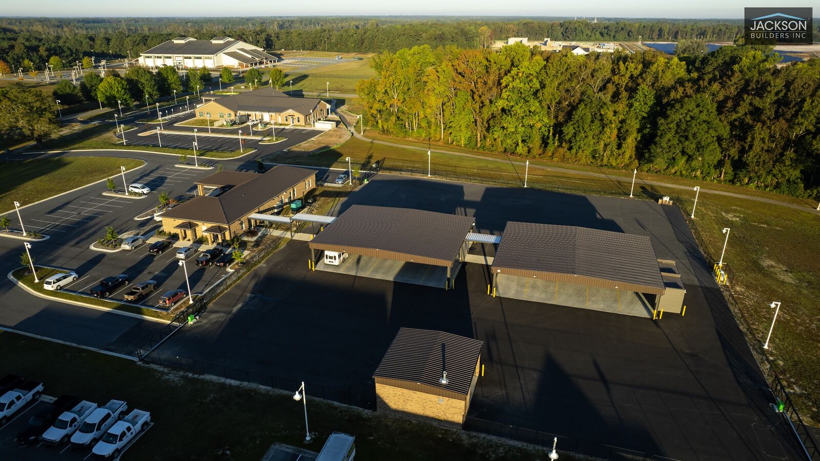 A high aerial view across the campus toward neighboring buildings and fields